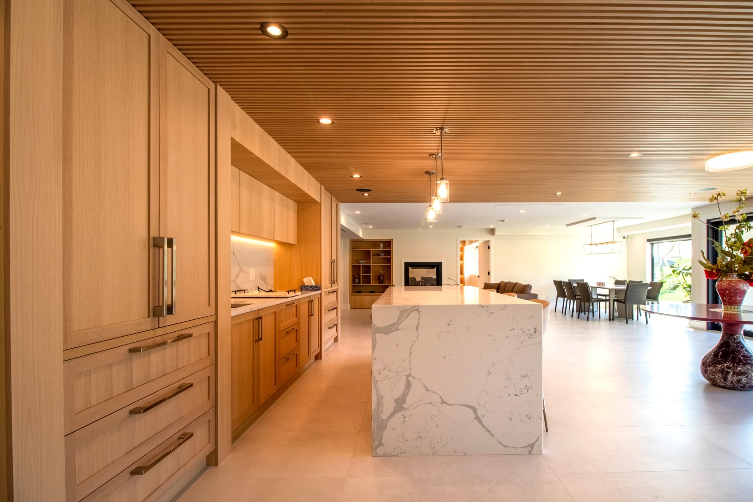 Rift-oak kitchen millwork in a Caliker Homes residence